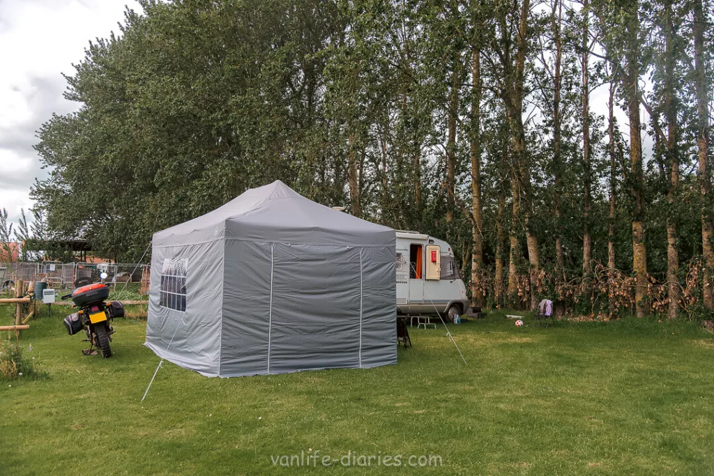 Hymer motorhome, Kawasaki motorcycle and gazebo