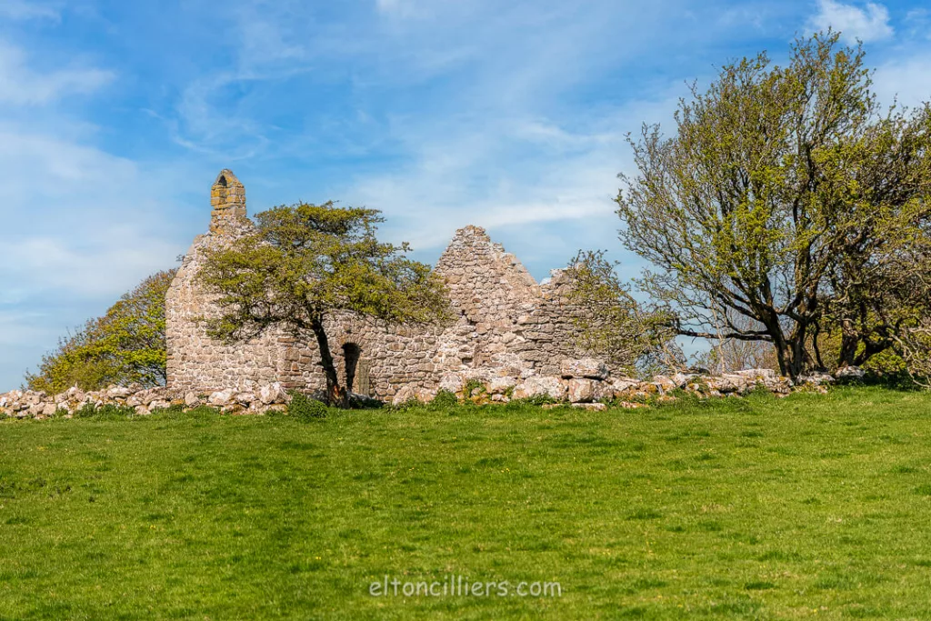 An exterior image of the ruins of Lligwy Chapel, Anglesey, Wales