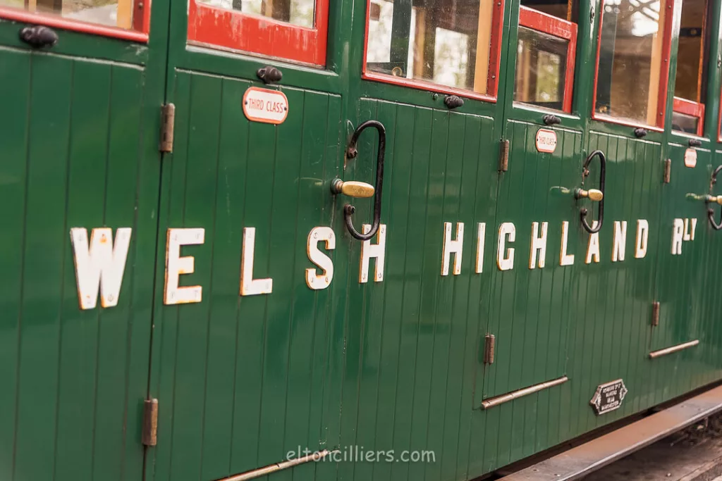Welsh Highlands Railway text on the side of green carriages